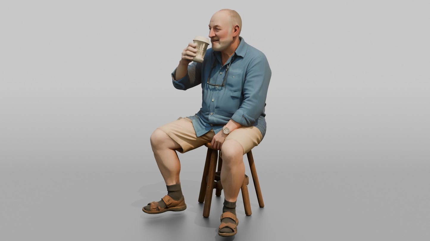 British Man Sitting with a Takeaway Coffee