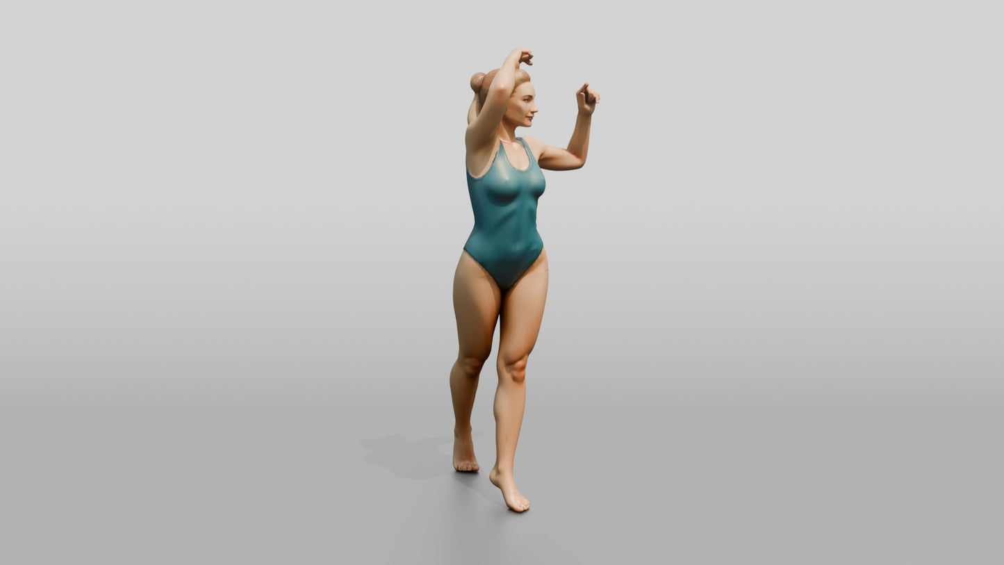 Woman in Teal Swimsuit in a Dancing Pose
