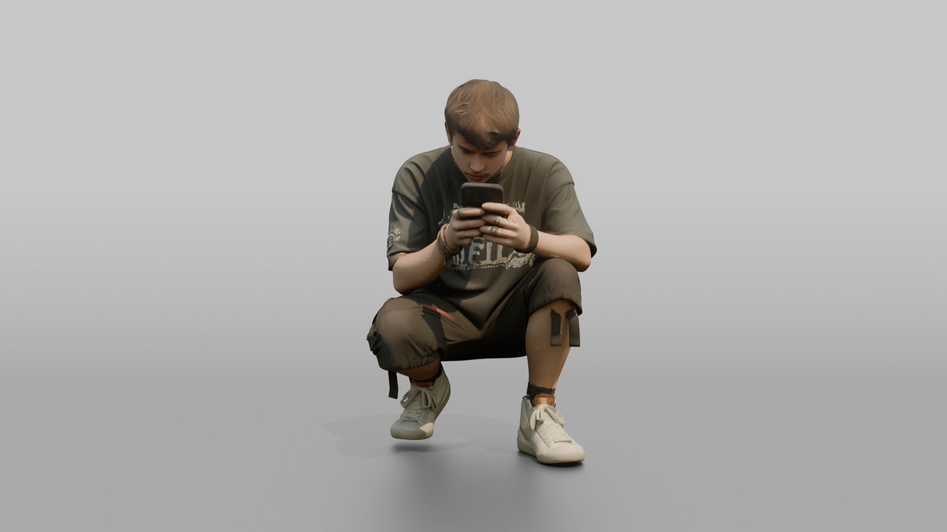 Teenage Boy Crouching to Look at His Phone