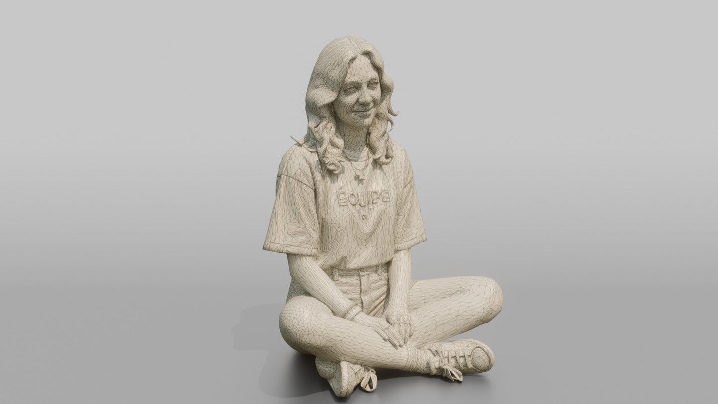 Teenage Girl Sitting Cross-Legged in Streetwear