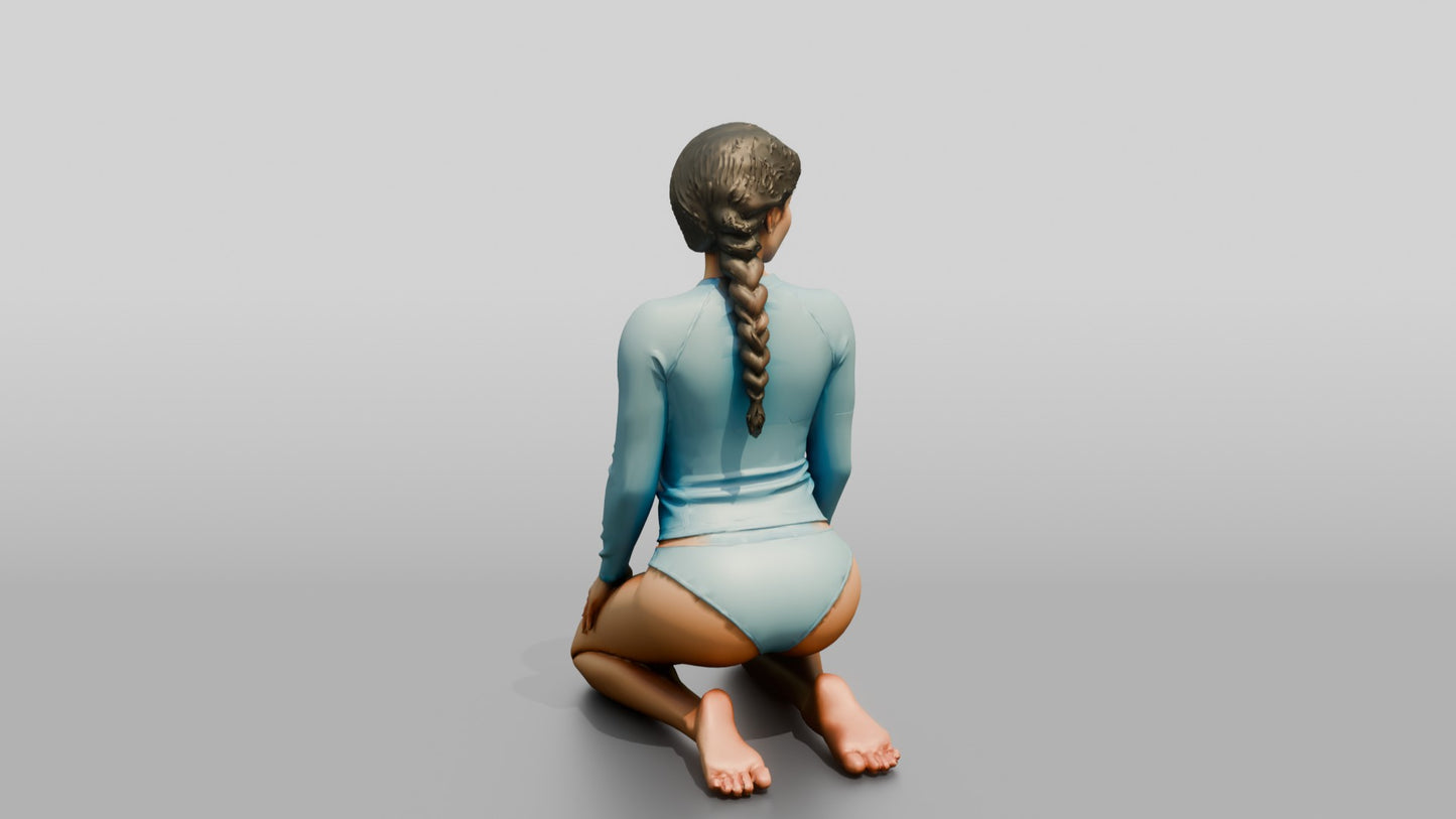 Woman in Blue Rash Guard Kneeling