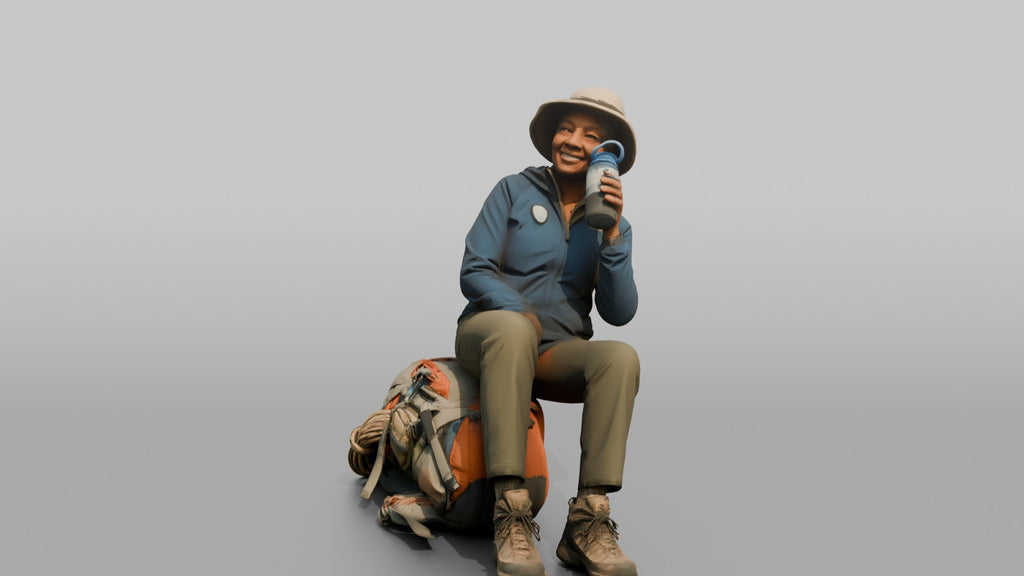 Hiker Sitting on Her Backpack, Taking a Break