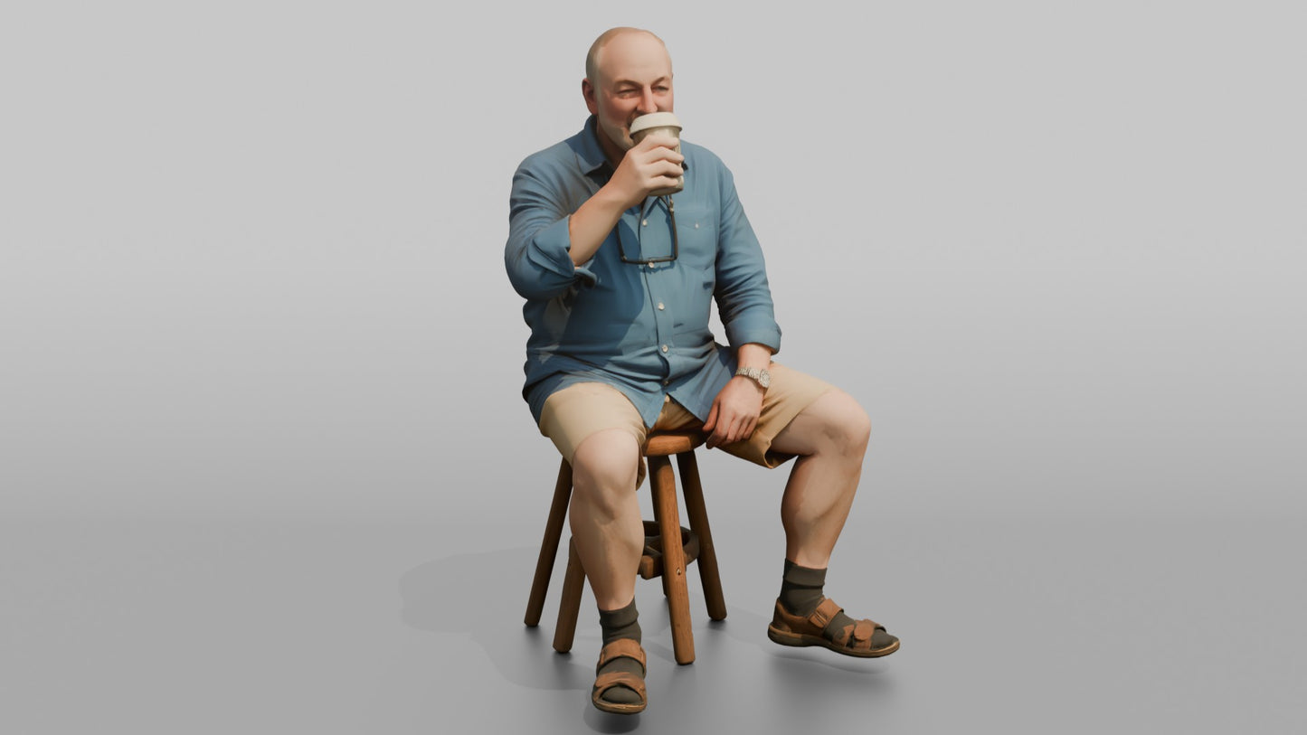 British Man Sitting with a Takeaway Coffee