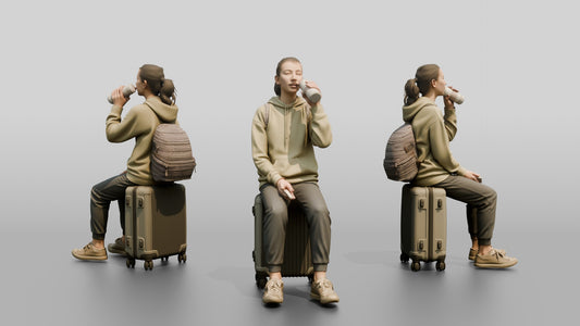 Young Woman Seated on Suitcase Drinking from Travel Cup