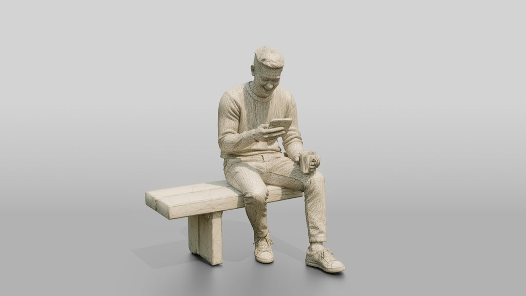 Young Chinese Man Relaxing on a Bench with Phone
