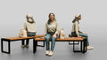 Young Woman Sitting on Bench with Backpack