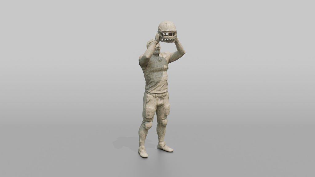 Player Raising His Helmet Triumphantly