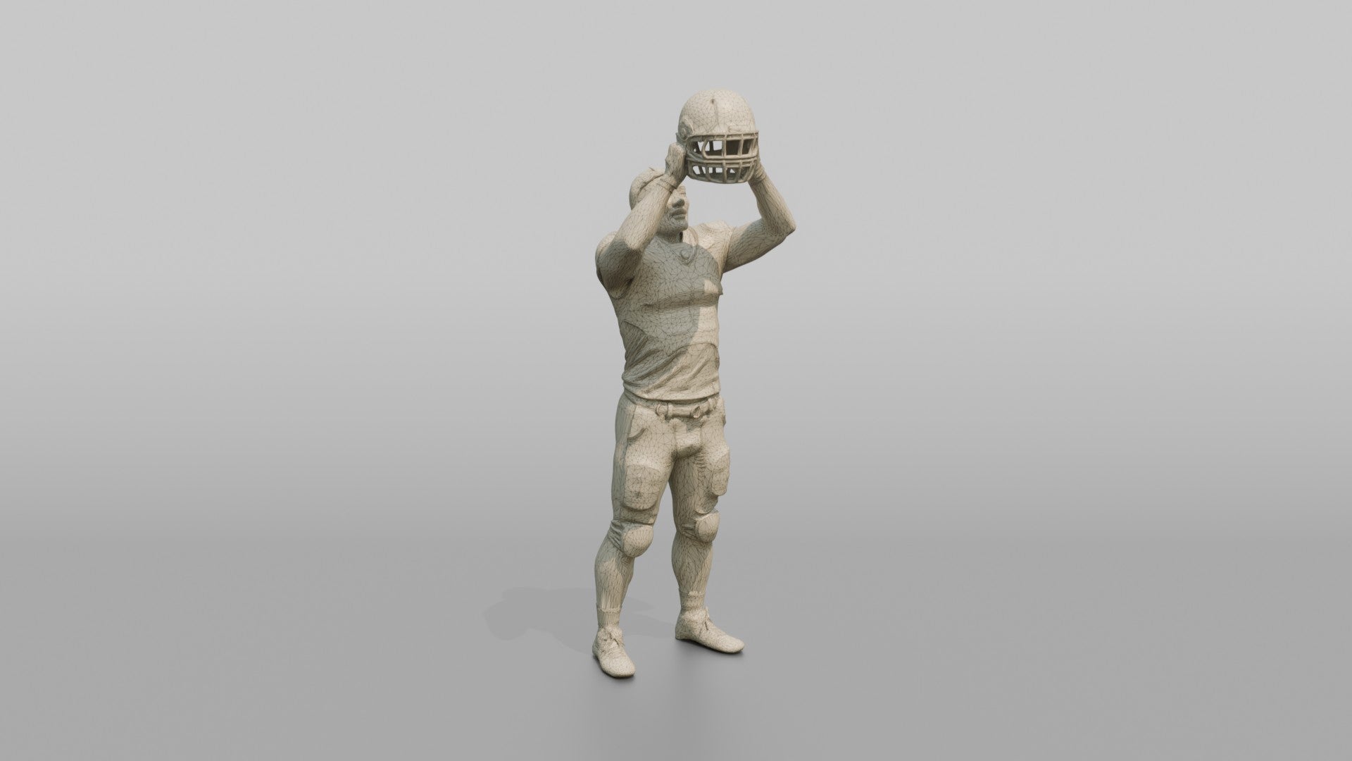 Player Raising His Helmet Triumphantly