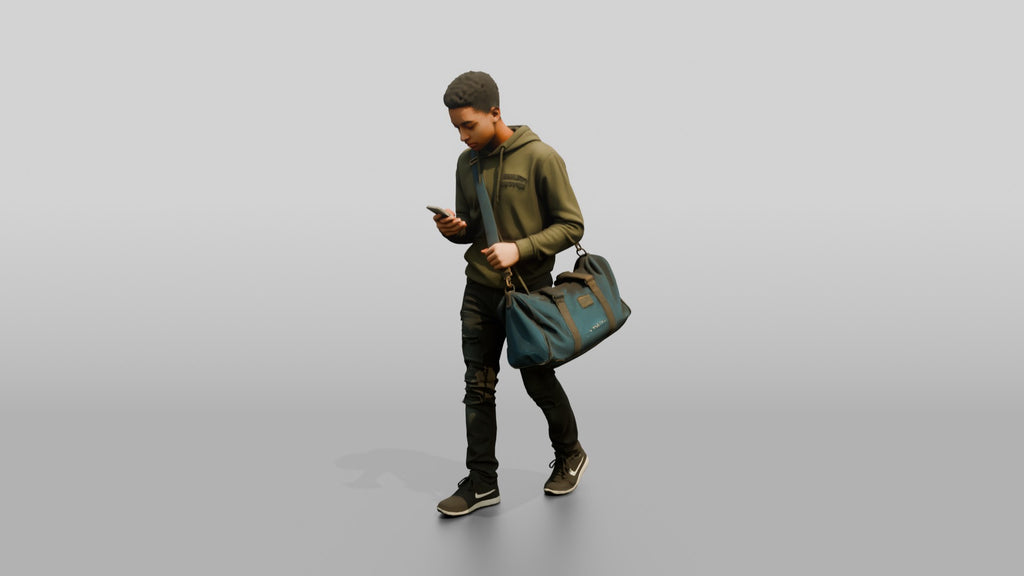 Young Black Man Walking and Looking at Phone with Duffel Bag